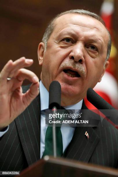 President of Turkey and Leader of the Justice and Development Party , Recep Tayyip Erdogan, gestures as he gives a speech during an AK party's group...