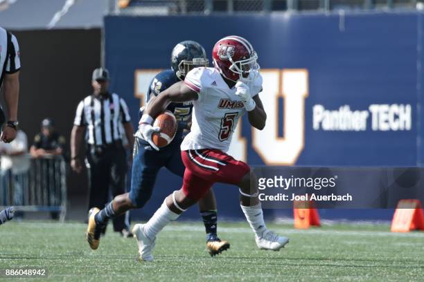 Jessie Britt of the Massachusetts Minutemen runs with the ball against the Florida International Golden Panthers on December 2, 2017 at Riccardo...