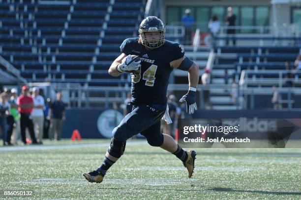 Jacob Kraut of the Florida International Golden Panthers runs with the ball against the Massachusetts Minutemen on December 2, 2017 at Riccardo Silva...