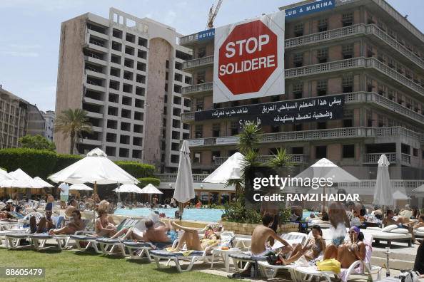 Lebanese people sunbathe at the Saint Ge Lebanese people sunbathe at the Saint Ge