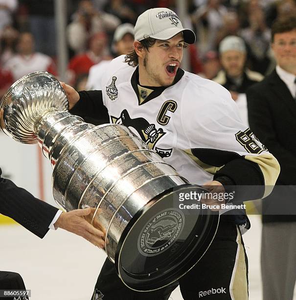 Sidney Crosby of the Pittsburgh Penguins holds the Stanley Cup following the Penguins victory over the Detroit Red Wings in Game Seven of the 2009...