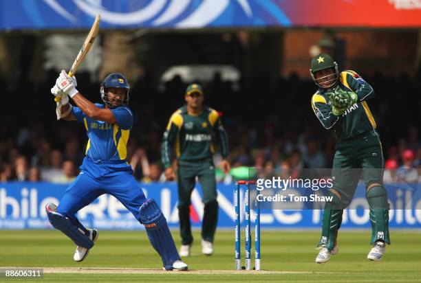 Kumar Sangakkara of Sri Lanka hits out as Kamran Akmal of Pakistan takes evasive action during the ICC World Twenty20 Final between Pakistan and Sri...