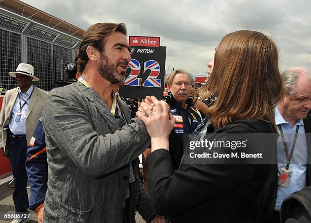 Eric Cantona meets Kasabian frontman Tom Meighan at the British F1 Grand Prix on June 21, 2008 in London, England.