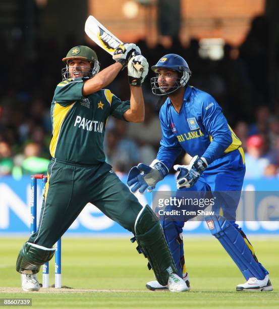 Shahid Afridi of Pakistan hits out watched by Kumar Sangakkara of Sri Lanka during the ICC World Twenty20 Final between Pakistan and Sri Lanka at...
