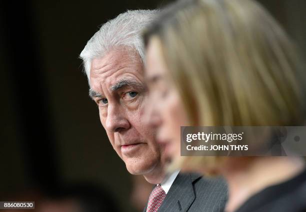 Secretary of State Rex Tillerson looks on next to EU foreign policy chief Federica Mogherini during a joint press conference at the European Union...