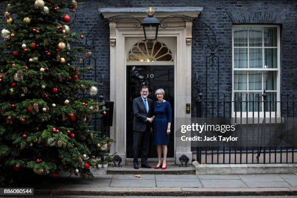 British Prime Minister Theresa May greets Spanish Prime Minister Mariano Rajoy on Downing Street on December 5, 2017 in London, England. Mrs May and...