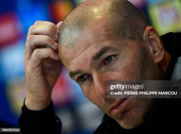 Real Madrid's French coach Zinedine Zidane gives a press conference following a training session at Valdebebas Sport City in Madrid on December 5,...