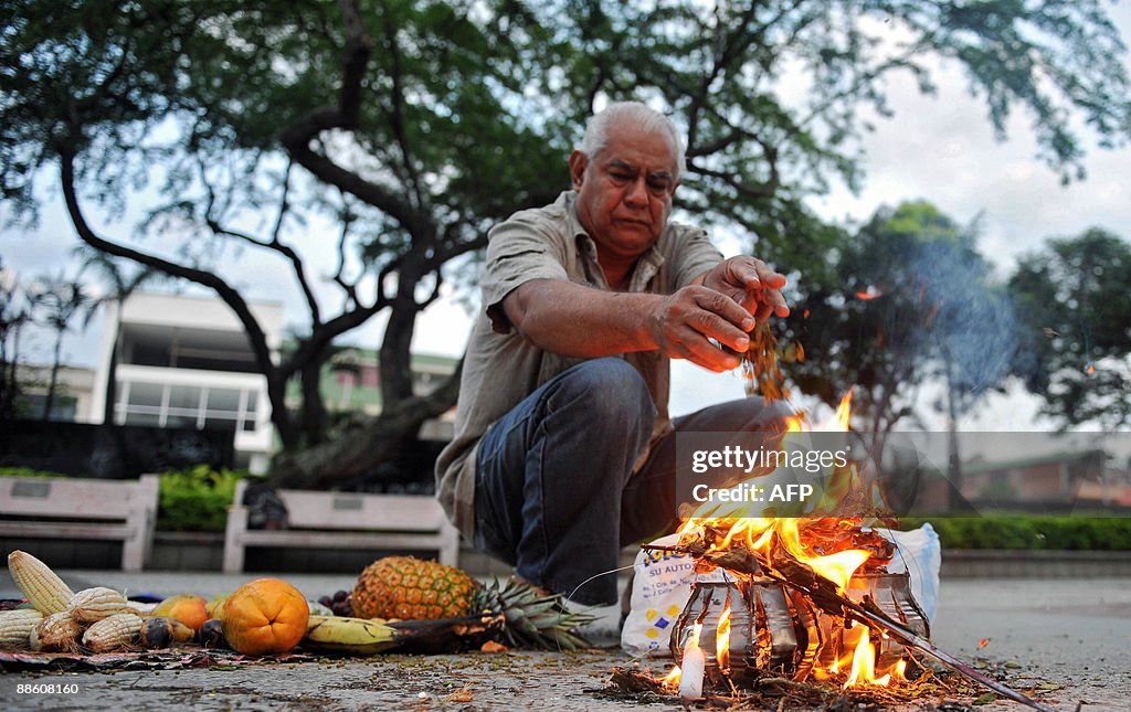 A man makes an offering during a ritual