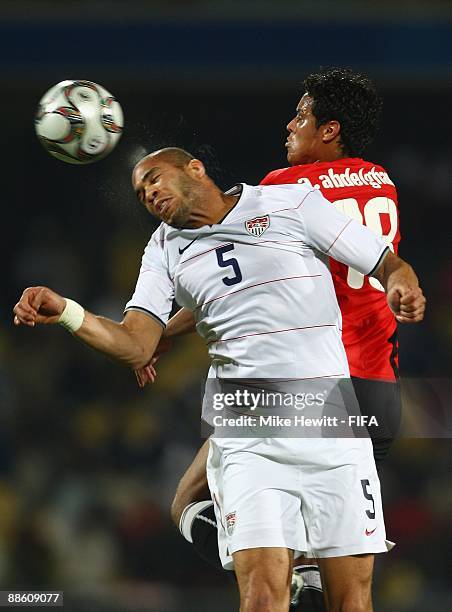Oguchi Onyewu of USA is challenged in the air by Ahmed Abdelghani of Egypt during the FIFA Confederations Cup Group B match between Egypt and USA on...