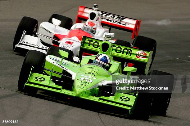 Dario Franchitti, driver of the TomTom Target Chip Ganassi Racing Dallara Honda leads Ryan Briscoe, driver of the Team Penske Dallara Honda, during...