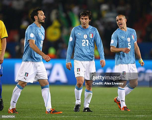 Gianluca Zambrotta, Andrea Pirlo and Fabio Cannavaro of Italy look dejected after defeat to Brazil in the FIFA Confederations Cup match between Italy...