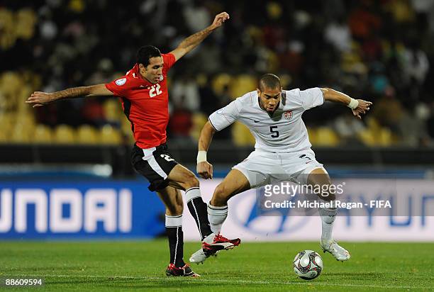 Mohamed Aboutrika of Egypt and Oguchi Onyewu of the USA during the Group B FIFA Confederations Cup match between Egypt and USA at the Royal Bafokeng...