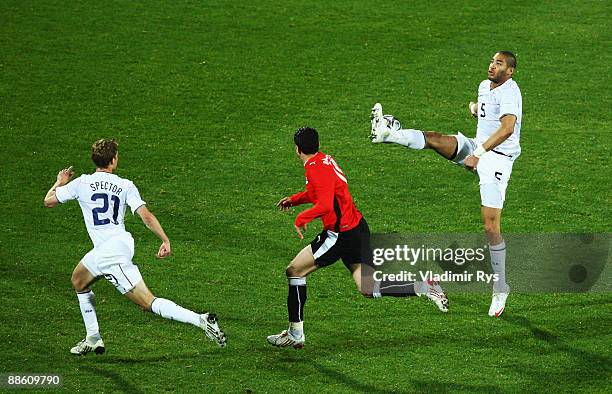 Jonathan Spector and his team mate Oguchi Onyewu of the USA defend as Ahmed Eid of Egypt attacks during the FIFA Confederations Cup match between...