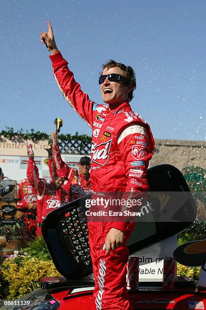 Kasey Kahne, driver of the Budweiser Dodge, celebrates in victory lane after winning the NASCAR Sprint Cup Series Toyota/Save Mart 350 at the...