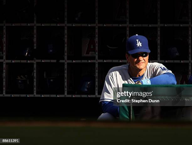 Manager Joe Torre of the Los Angeles Dodgers looks on from the dugout during the game with the Los Angeles Angels of Anaheim on June 21, 2009 at...