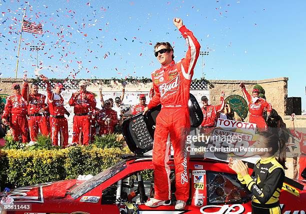 Kasey Kahne, driver of the Budweiser Dodge, celebrates in victory lane after winning the NASCAR Sprint Cup Series Toyota/Save Mart 350 at the...
