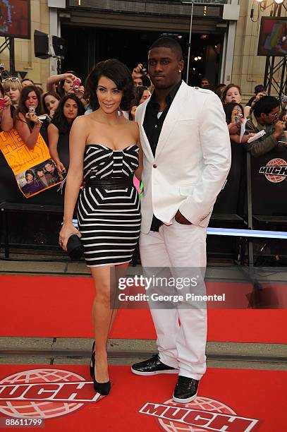 Kim Kardashian and Reggie Bush arrive on the red carpet of the 20th Annual MuchMusic Video Awards at the MuchMusic HQ on June 21, 2009 in Toronto,...