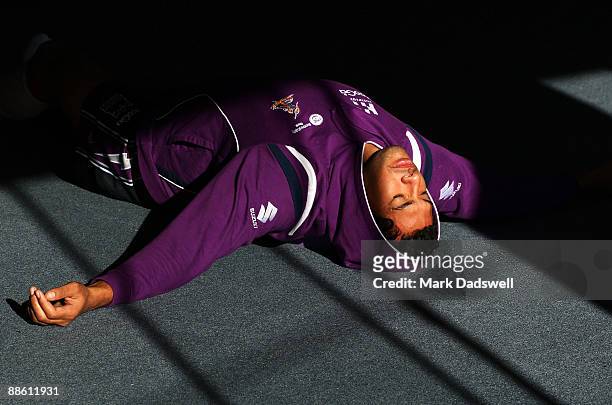 Sika Manu of the Melbourne Storm performs a yoga exercise during a Melbourne Storm NRL recovery session at Bridge Road Yoga Studios on June 22, 2009...