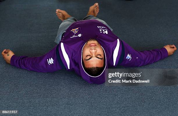 Sika Manu of the Melbourne Storm performs a yoga exercise during a Melbourne Storm NRL recovery session at Bridge Road Yoga Studios on June 22, 2009...