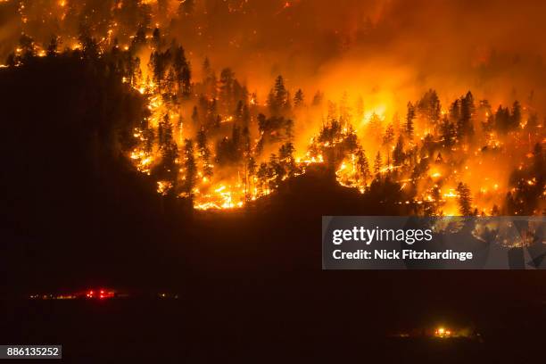 a wildfire frontline with emergency services nearby, okanagan valley, british columbia, canada - skogsbrand bildbanksfoton och bilder