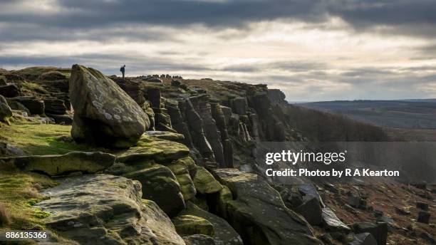 hiker on stanage edge, peak district, derbyshire - peak district stock pictures, royalty-free photos & images