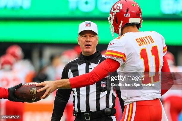 Kansas City Chiefs quarterback Alex Smith talks with referee John Parry prior to the National Football League game between the New York Jets and the...