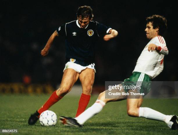 Charlie Nicholas of Scotland with Gueogui Dimitrov of Bulgaria during the Scotland v Bulgaria European Championship Qualifying match held in Glasgow,...