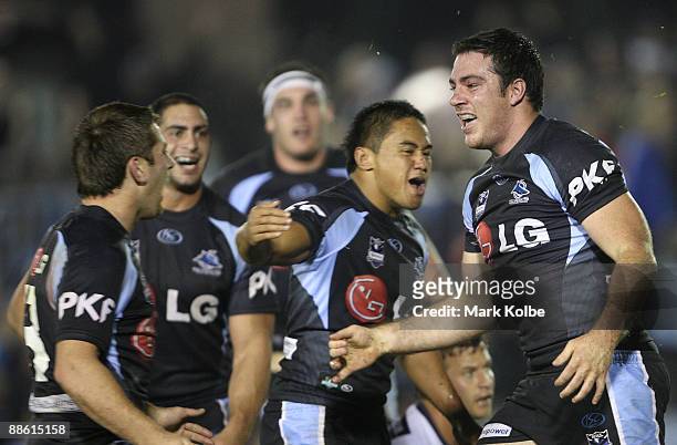 Grant Millington of the Sharks celebfrates after scoring his second try during the round 15 NRL match between the Cronulla Sharks and the Brisbane...