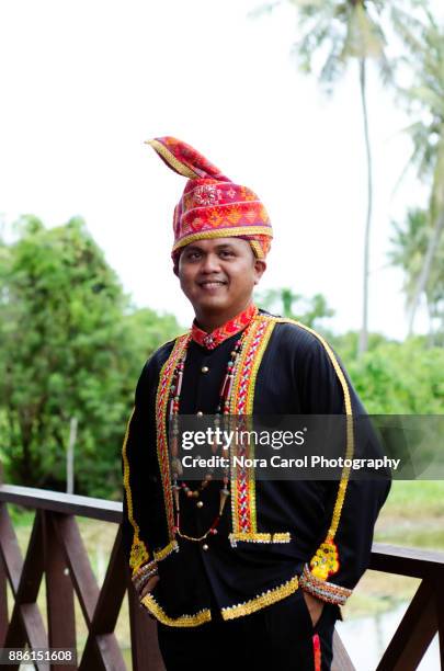 portrait of malaysia indigenous native dusun lotud in traditional clothing - sabah stock pictures, royalty-free photos & images