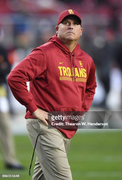 Head coach Clay Helton of the USC Trojans looks on while his team warms up prior to the start of the Pac-12 Football Championship Game against the...