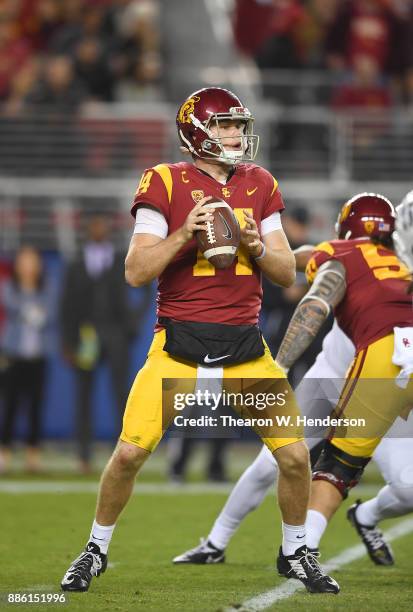 Sam Darnold of the USC Trojans looks to throw a pass against the Stanford Cardinal during the Pac-12 Football Championship Game at Levi's Stadium on...