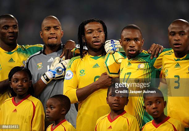 MacBeth Sibaya of South Africa stands with his teammates listening to his countries national anthem prior to the FIFA Confederations Cup match...