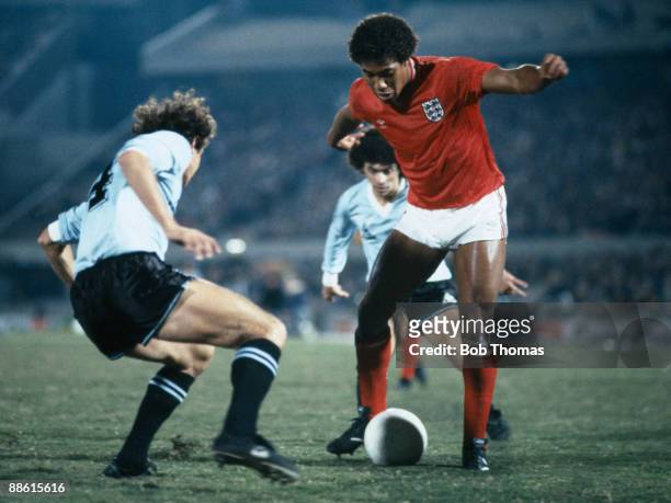 England's John Barnes is faced by Uruguayan defender Nestor Montelongo during the International friendly match between Uruguay and England at the...