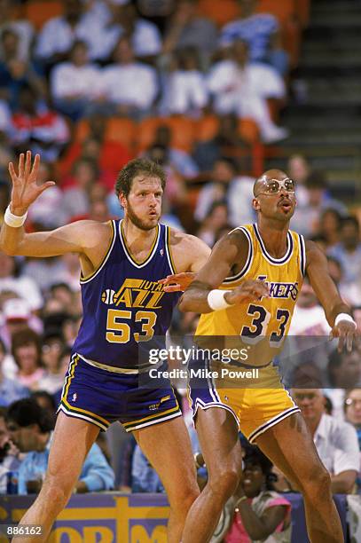 Mark Eaton of the Utah Jazz guards Kareem Abdul-Jabbar of the Los Angeles Lakers during an NBA game at The Salt Palace in Salt Lake City, Utah in...