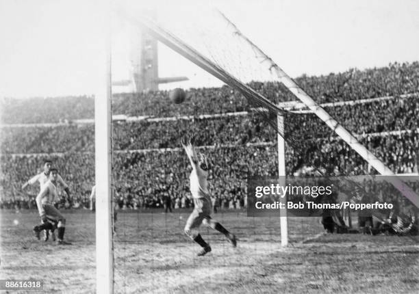 Argentinian goalkeeper Juan Botasso is beaten by Hector Castro for Uruguay's 4th goal during the FIFA World Cup Final at the Estadio Centenario in...