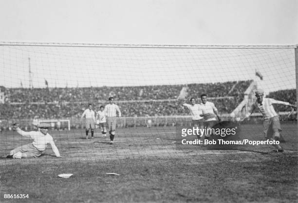 Argentinian goalkeeper Juan Botasso is beaten, and defender Juan Evaristo can't clear the ball off the line as Pablo Dorado's shot gives Uruguay an...