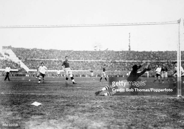 Romanian goalkeeper Ion Lapusneanu dives to make a save during the FIFA World Cup match between Uruguay and Romania at the Estadio Centenario in...