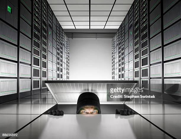 intruder enters into server room - thief stock pictures, royalty-free photos & images