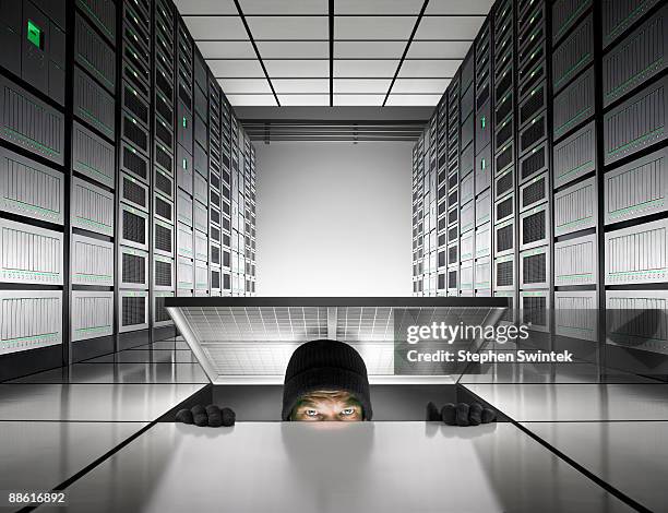 intruder enters into server room - the intruder imagens e fotografias de stock