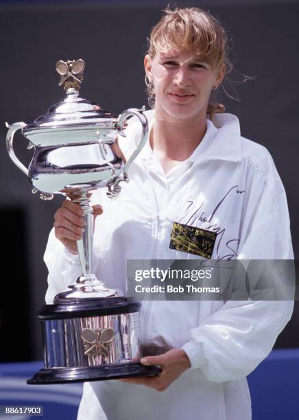 Steffi Graf Of Germany Holding The Trophy After Winning The Ladies steffi-graf-of-germany-holding-the-trophy-after-winning-the-ladies