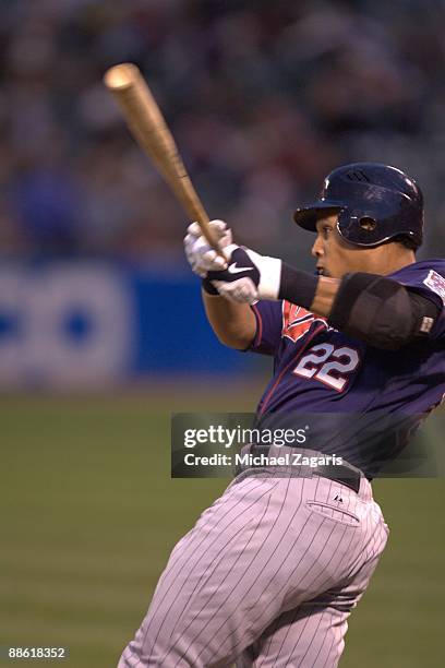 Carlos Gomez of the Minnesota Twins swings at a pitch during the game against the Oakland Athletics at the Oakland Coliseum on June 9, 2009 in...