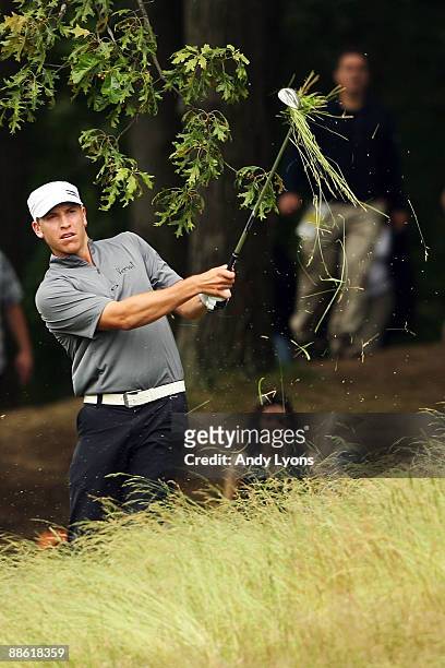 Ricky Barnes watches his third shot on the fifth hole during the continuation of the final round of the 109th U.S. Open on the Black Course at...