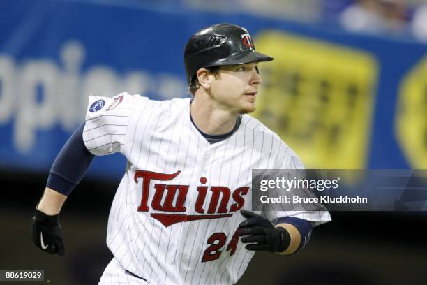 June 18: Joe Crede of the Minnesota Twins runs to first against the Pittsburgh Pirates on June 18, 2009 at the Metrodome in Minneapolis, Minnesota....