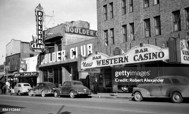 Woman stands in front of New Western Casino and Boulder Club on Fremont Avenue in Las Vegas, Nevada, circa 1940. The Boulder Club was built in 1929...