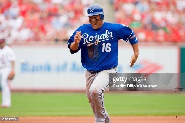 Billy Butler of the Kansas City Royals runs to third base against the St. Louis Cardinals on May 24, 2009 at Busch Stadium in St. Louis, Missouri....