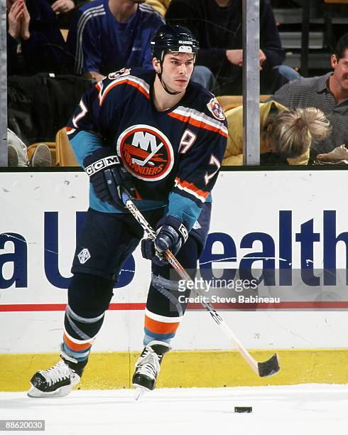 Scott Lachance of the New York Islanders skates with puck against the Boston Bruins at the Fleet Center.
