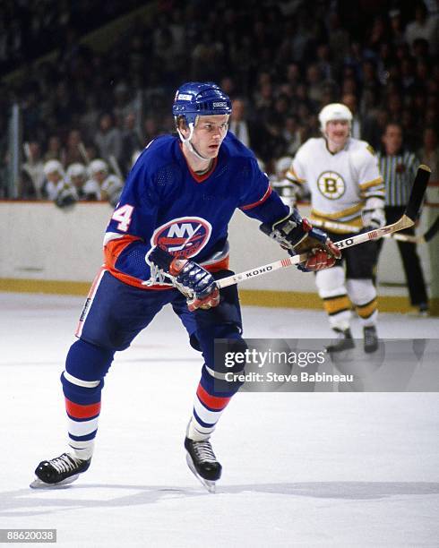 Bob Bourne of the New York Islanders skates against the Boston Bruins at Boston Garden.