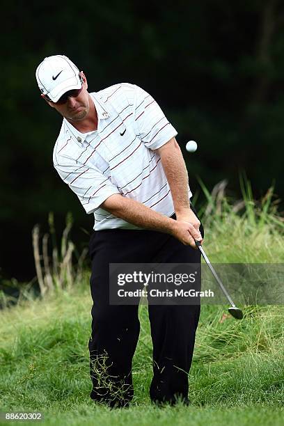 David Duval pitches to the seventh green during the continuation of the final round of the 109th U.S. Open on the Black Course at Bethpage State Park...