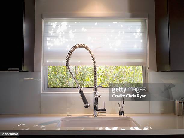 interior of modern kitchen and spray nozzle - spray nozzle stock pictures, royalty-free photos & images