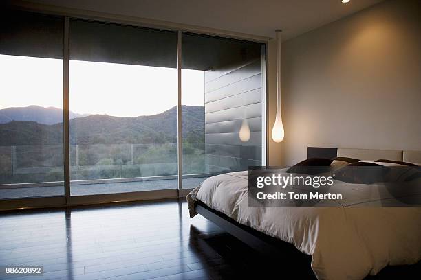 modern bedroom and glass wall - modern bedroom stock pictures, royalty-free photos & images